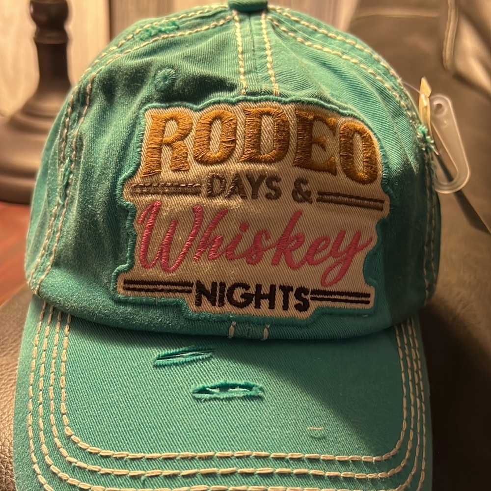 Rodeo Days and Whiskey Nights distressed truckers cap.